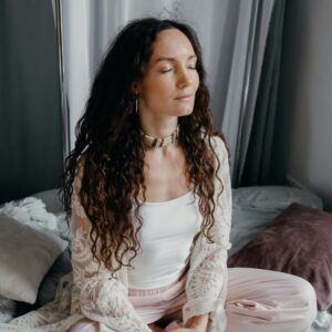 a woman sitting on the bed